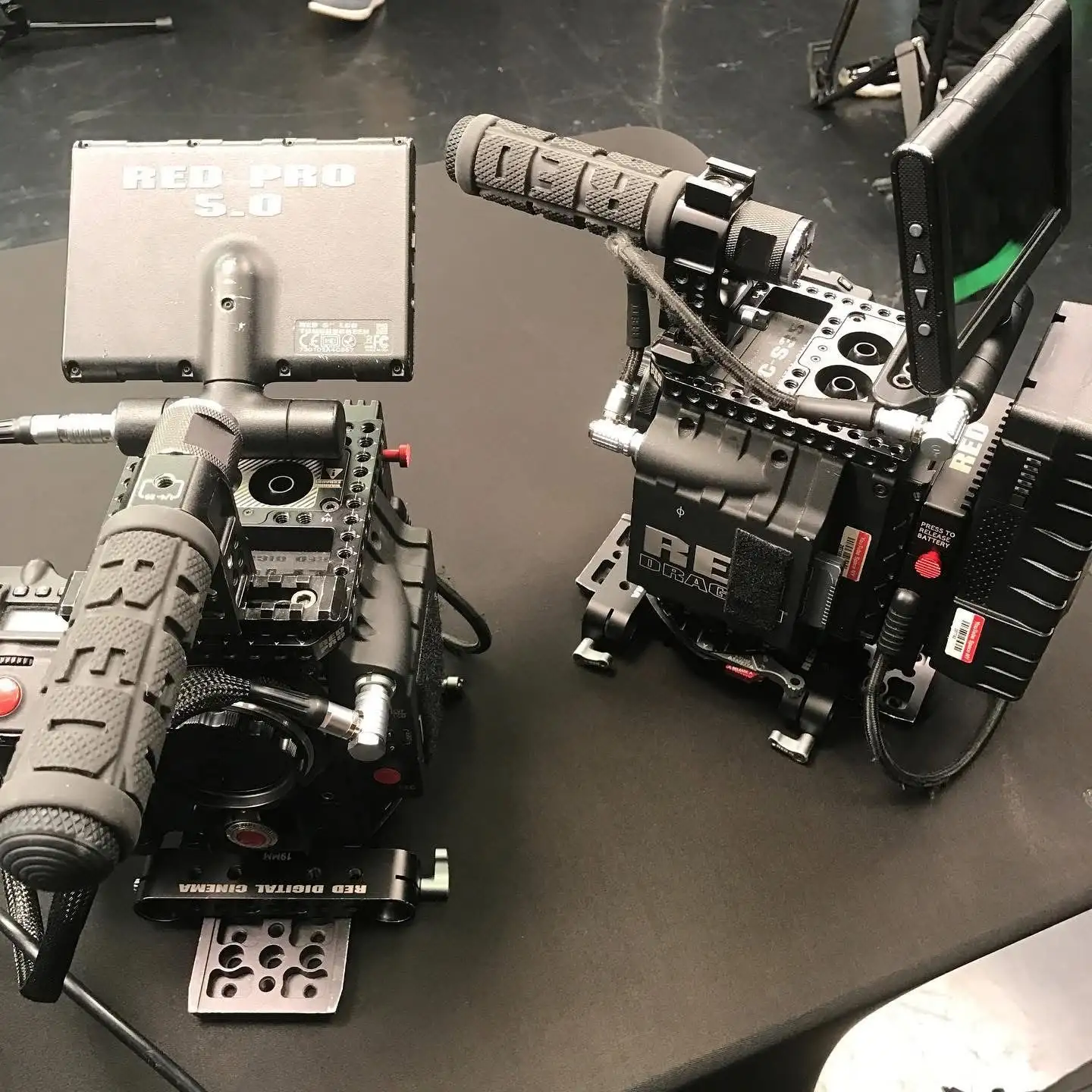 Two RED cinema cameras fully rigged for professional video production services.
